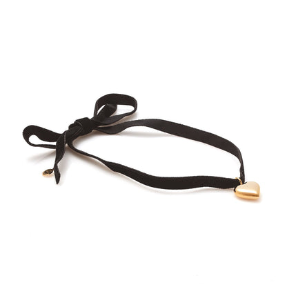 Silk & Steel cupid choker necklace in black velvet ribbon and puffed heart pendant in 14k gold-plated stainless steel.